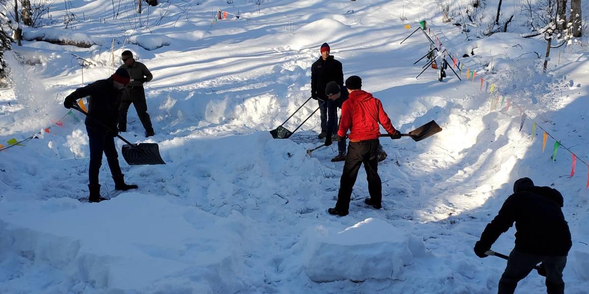 BC students shoveling a path in the snow in Alaska