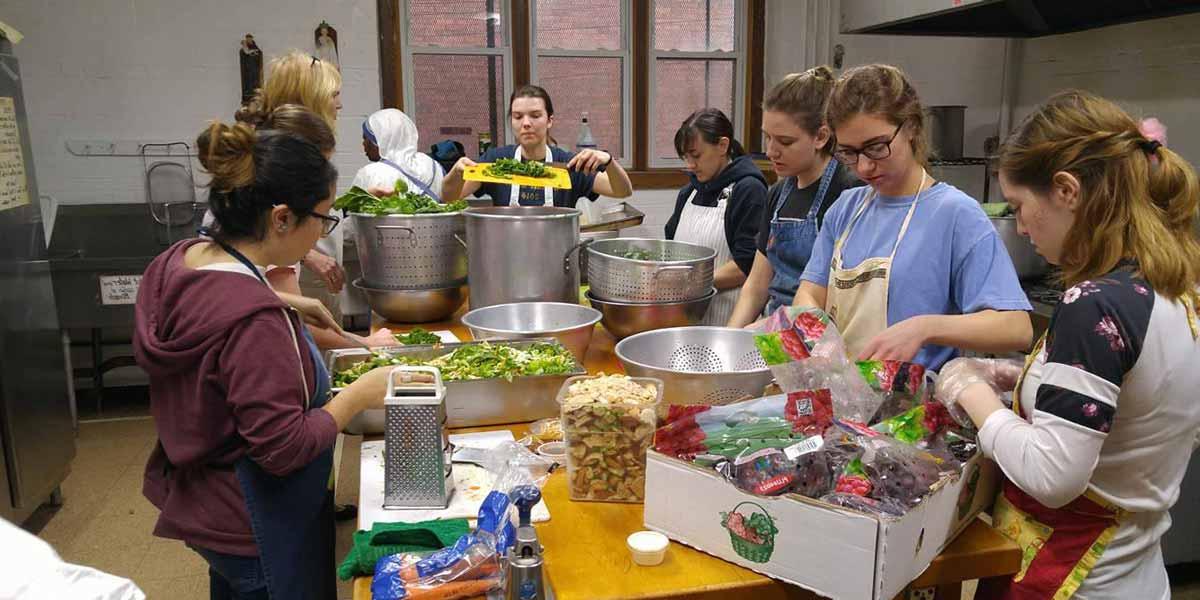 Missionaries preparing food
